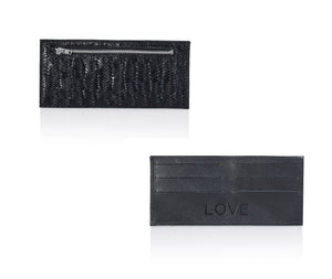 This slim and practical black leather wallet is designed to be added to your favorite bag or purse without adding unnecessary bulk to your look. Features 6 card slots for up to 18 cards, a zip pocket for cash, and a minimalist luxury design for everyday use & style. This magical accessory is the ideal gift for any occasion.