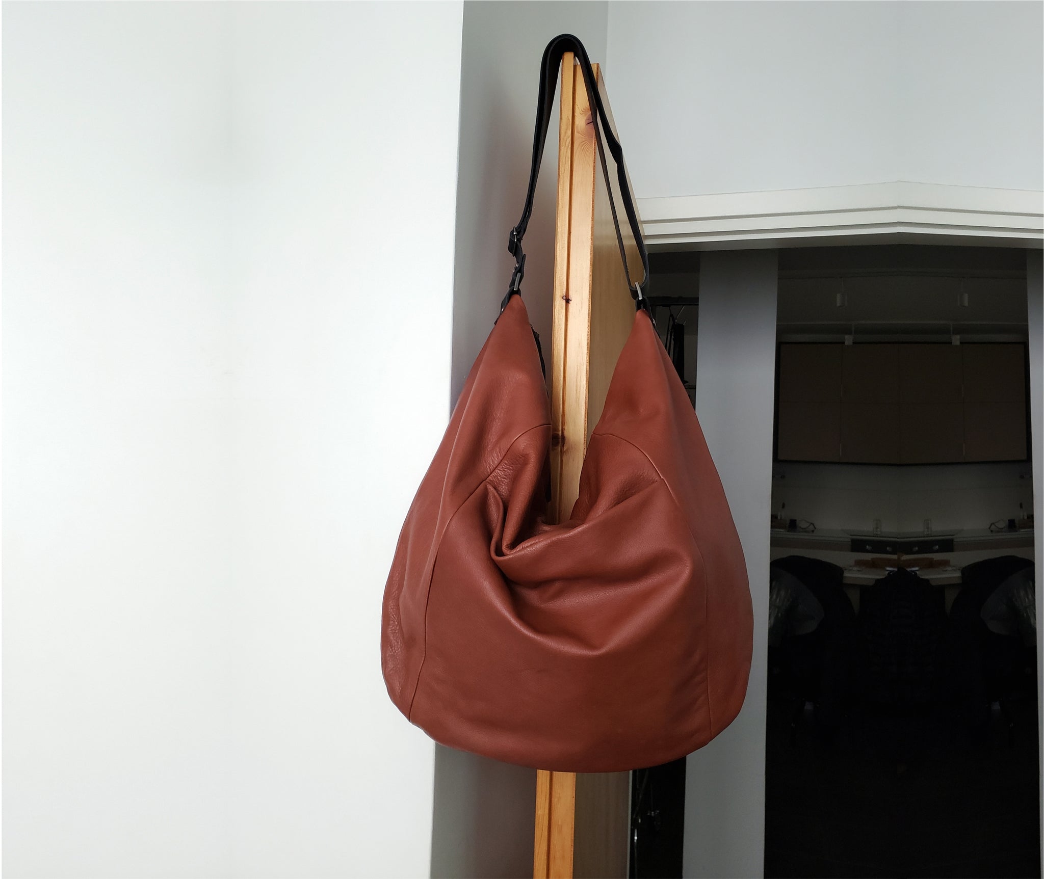 This leather hobo bag is handmade with soft premium quality Italian leather, featuring an adjustable sleek matte black leather shoulder strap that fits seamlessly with every outfit color & style. This large leather bag can be carried crossbody or on the shoulder, showing off it`s beautiful leather drop. Its ideal minimalist design is suitable for long active days & use.