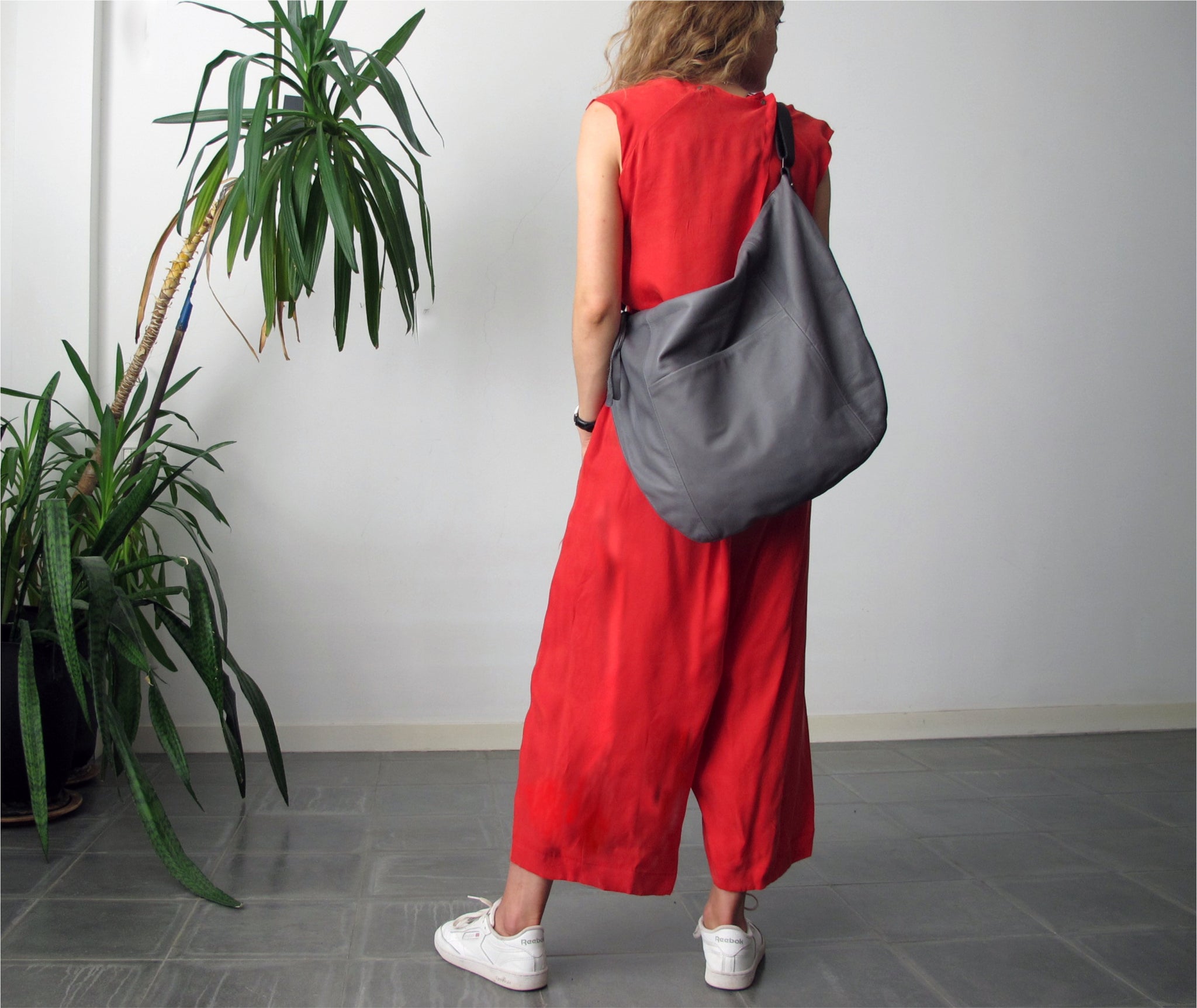 This leather hobo bag is handmade with soft premium quality Italian leather, featuring an adjustable sleek matte black leather shoulder strap that fits seamlessly with every outfit color & style. This large leather bag can be carried crossbody or on the shoulder, showing off it`s beautiful leather drop. Its ideal minimalist design is suitable for long active days & use.