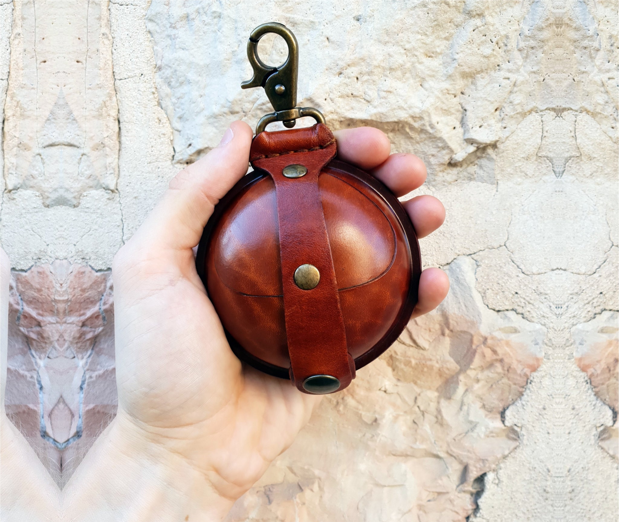 This unisex bestseller leather coin purse is handmade with sturdy Italian leather. It`s ball-shaped, lightweight with a clean cut, and can be attached to your bag, keychain, belt loops, or strap. The perfect coin pouch, earbuds case, keyholder wallet, change purse, and gift for him or her.  